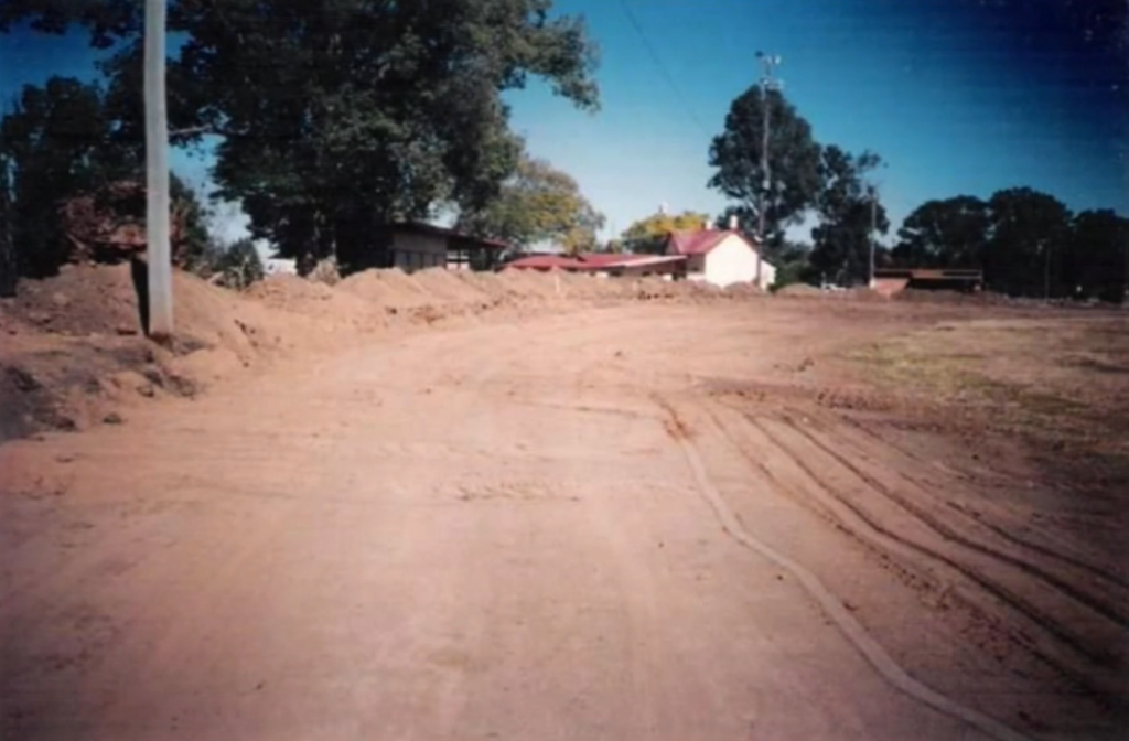 Old Timber Fence Removed, Dirt Dug back for new Concrete Wall. Looking from tower to corner 4